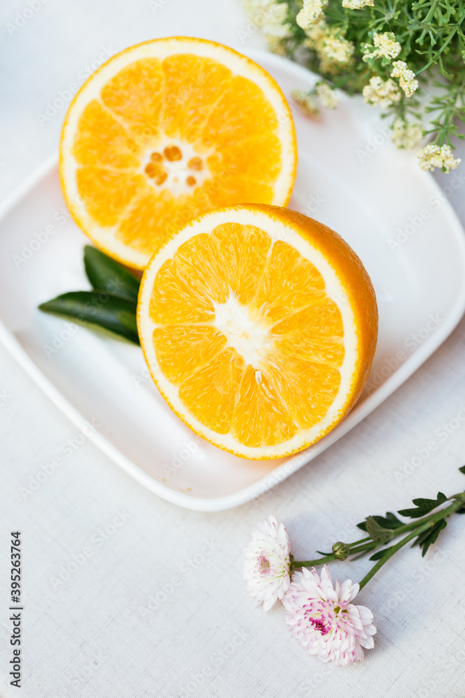 Ripe Navel orange and flower Ripe Navel orange and flower