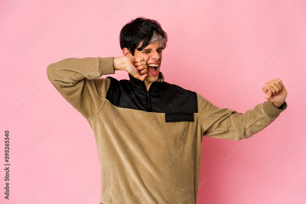Young skinny hispanic man dancing and having fun. Young skinny hispanic man dancing and having fun.