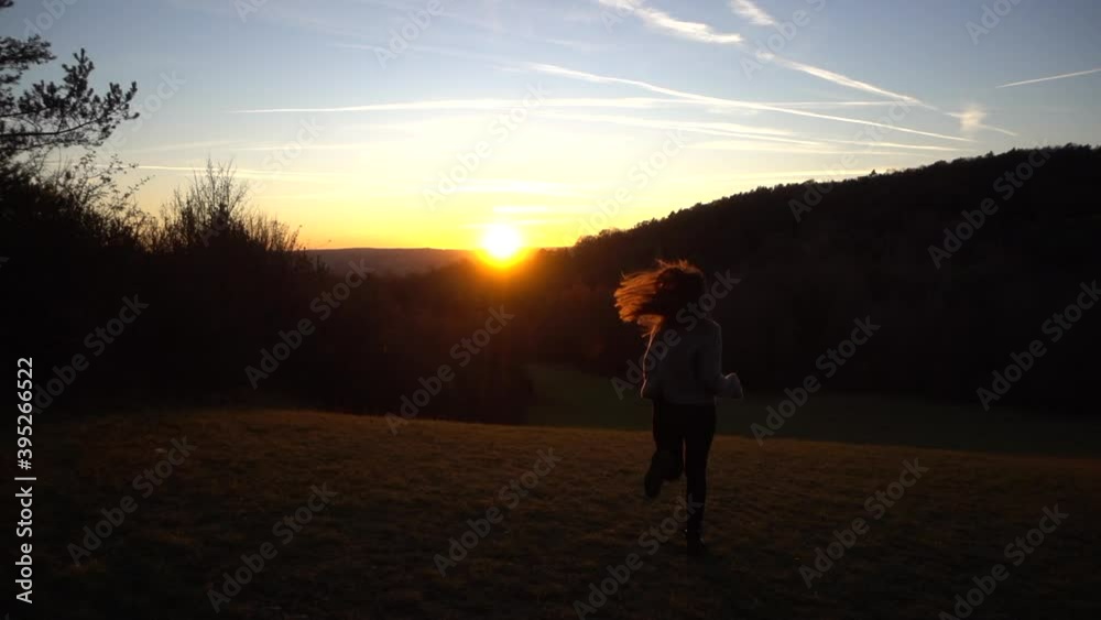 Girl running in the sunset being happy and feeling freedom, determined attractive good looking woman walking, sports & fitness, endurance, activities, energy, happiness, Slow Motion Girl running in the sunset being happy and feeling freedom, determined attractive good looking woman walking, sports & fitness, endurance, activities, energy, happiness, Slow Motion