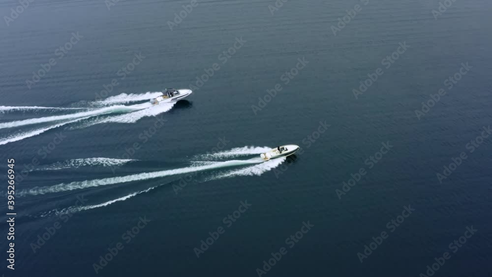 Flying Away Shot of Speed Boats Sailing On Lake Along Each Other. Flying Away Shot of Speed Boats Sailing On Lake Along Each Other.