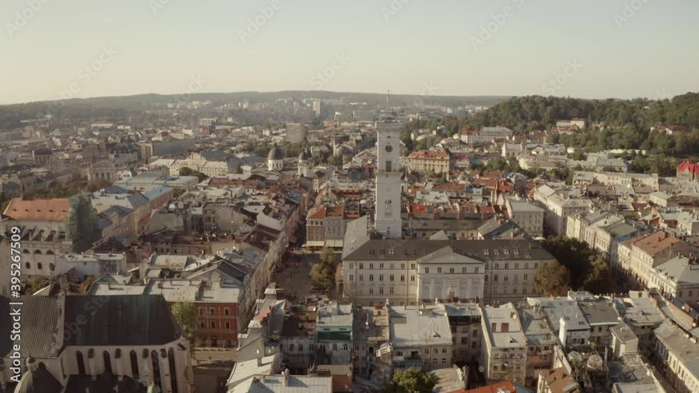 City panorama from above. Lviv, an old European city. City hall, temples, buildings with red roofs and streets on a sunny day City panorama from above. Lviv, an old European city. City hall, temples, buildings with red roofs and streets on a sunny day