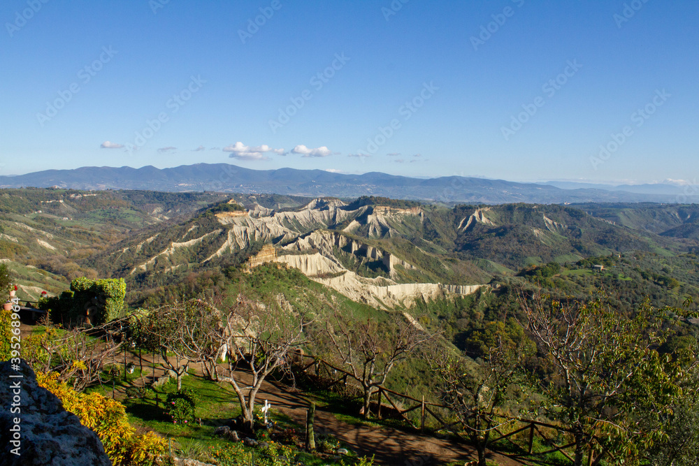 Remote view of the valley of the badlands, formed by landslides and by the erosion of the tufa, lava and clayey rock.Civita di Bagnoregio,Italy.
