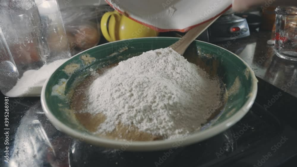 Adding Flour To Cookie Dough Mixture In The Kitchen - close up Adding Flour To Cookie Dough Mixture In The Kitchen - close up