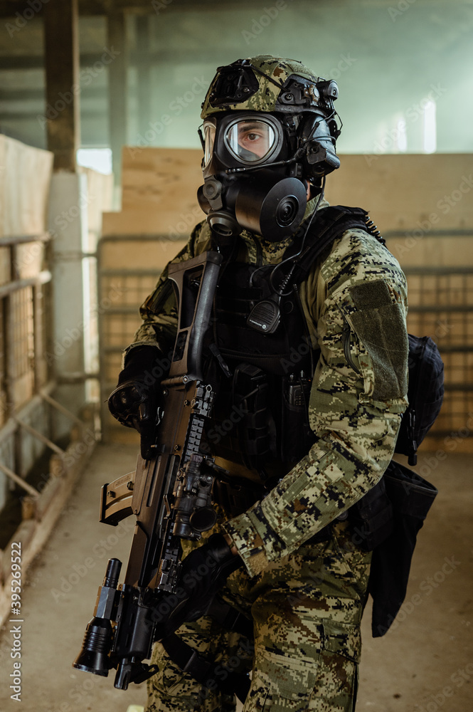 Croatian soldier in Cropat woodland uniform wearing gas mask M95 and assault rifle G36. Croatian soldier in Cropat woodland uniform wearing gas mask M95 and assault rifle G36.