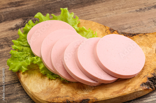 Sliced sausage snak over board