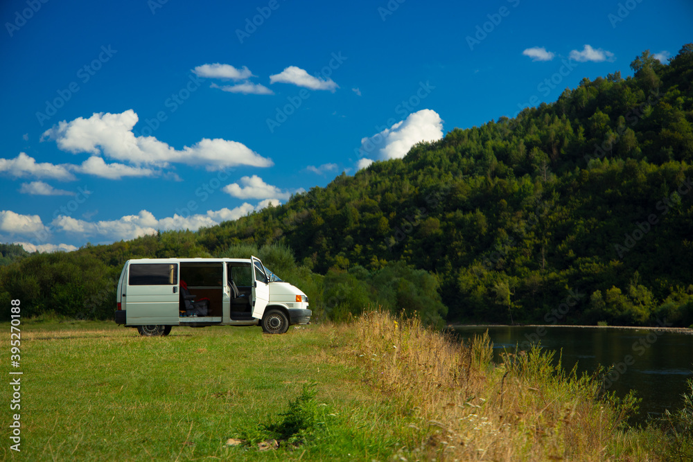minibus white transport stop in beautiful mountain nature picturesque environment space in summer clear weather day minibus white transport stop in beautiful mountain nature picturesque environment space in summer clear weather day