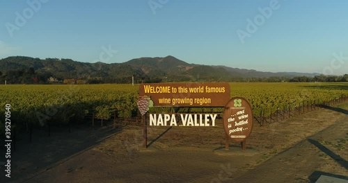 Pan down aerial shot of the welcome to the napa valley sign