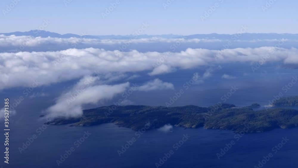 Flying over the beautiful clouds and landscape of Canada -aerial Flying over the beautiful clouds and landscape of Canada -aerial