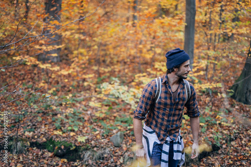 man walking in the autumn forest