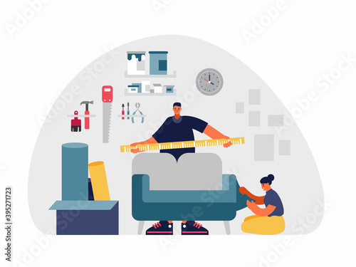 Man and woman upholstering furniture in workshop