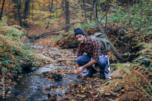 handsome man by the river in the forest © eastwest photo