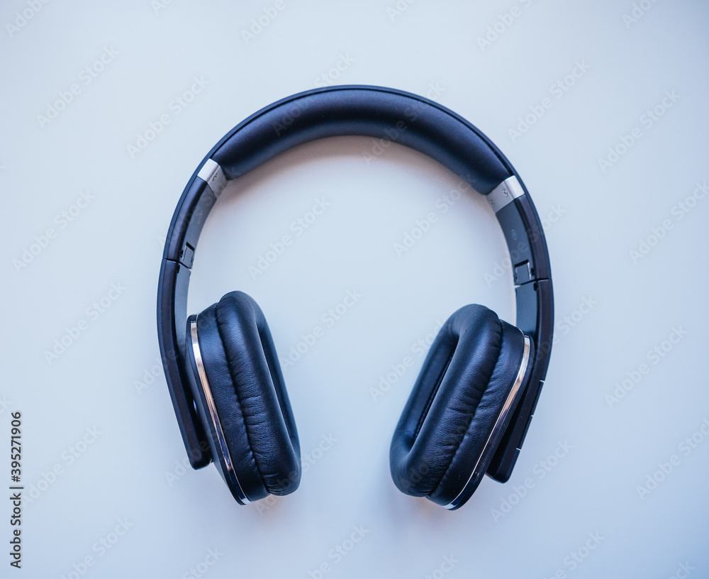 Black headphones with white background. Musical concept. Black headphones with white background. Musical concept.