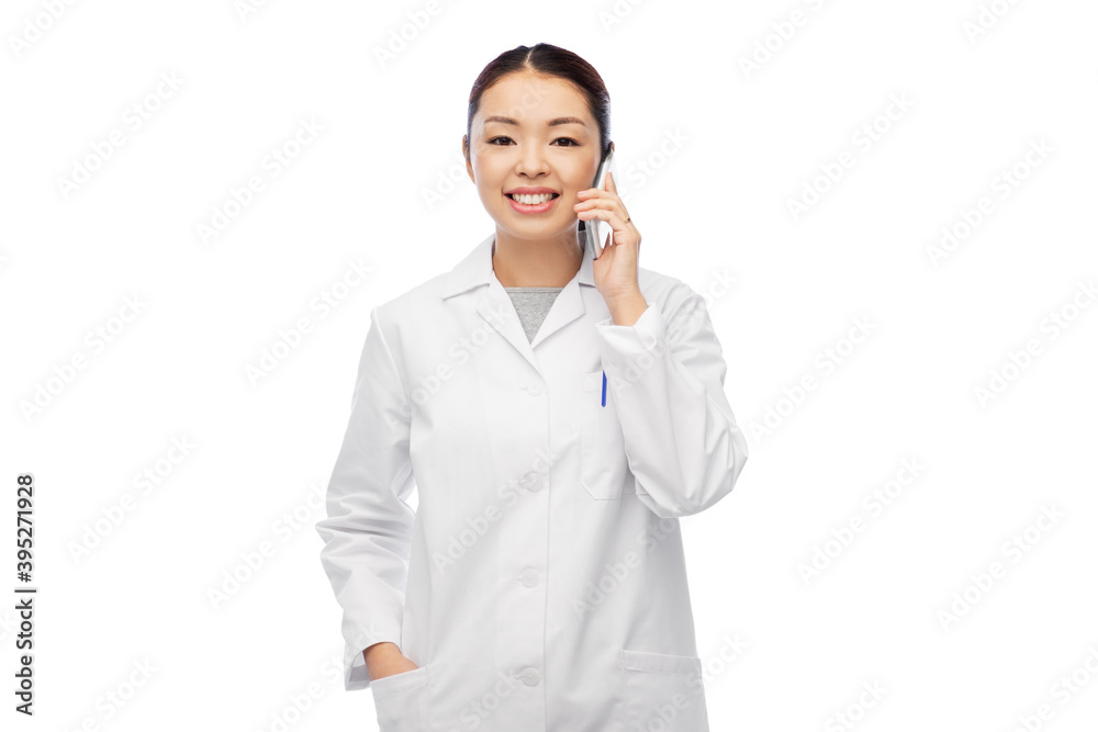 medicine, profession and healthcare concept - happy smiling asian female doctor or scientist in lab coat calling on smartphone over white background medicine, profession and healthcare concept - happy smiling asian female doctor or scientist in lab coat calling on smartphone over white background