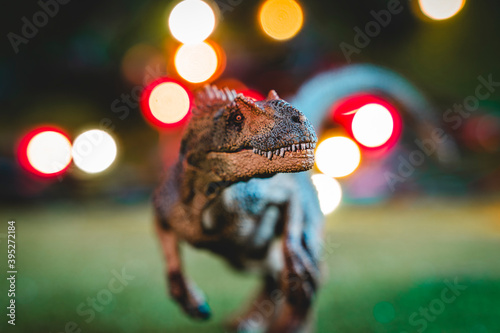 plastic statuette of velociraptor studio shot photo