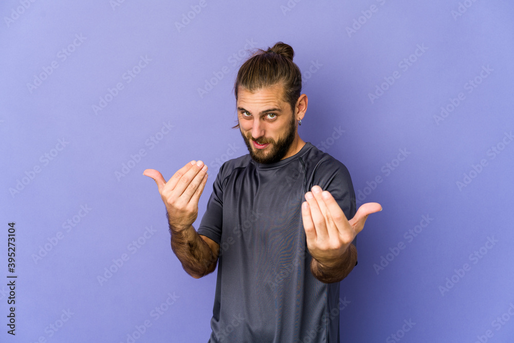 Young man with long hair look showing a welcome expression. Young man with long hair look showing a welcome expression.