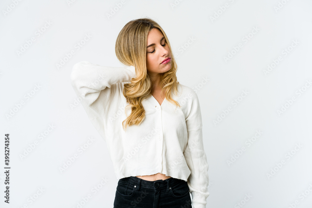 Young caucasian blonde woman suffering neck pain due to sedentary lifestyle. Young caucasian blonde woman suffering neck pain due to sedentary lifestyle.