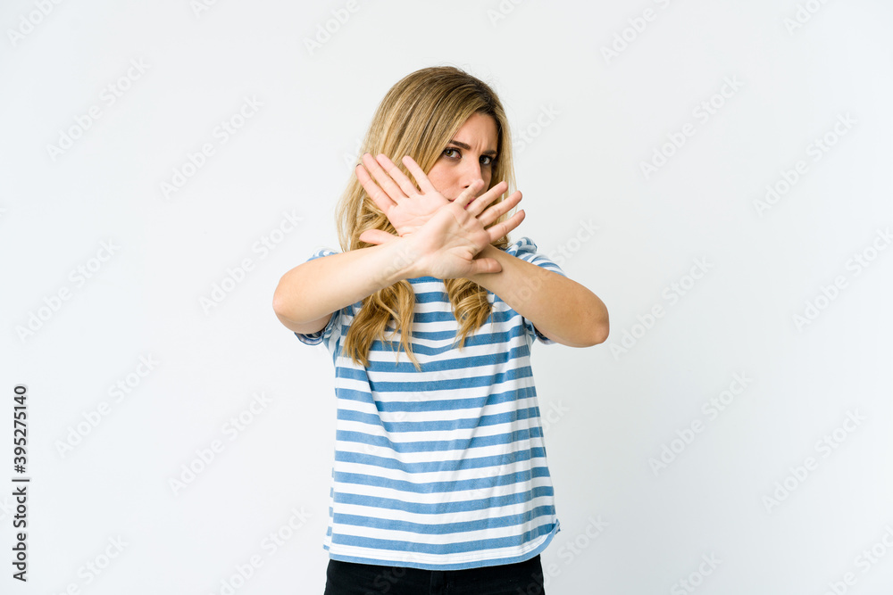 Young caucasian blonde woman doing a denial gesture Young caucasian blonde woman doing a denial gesture