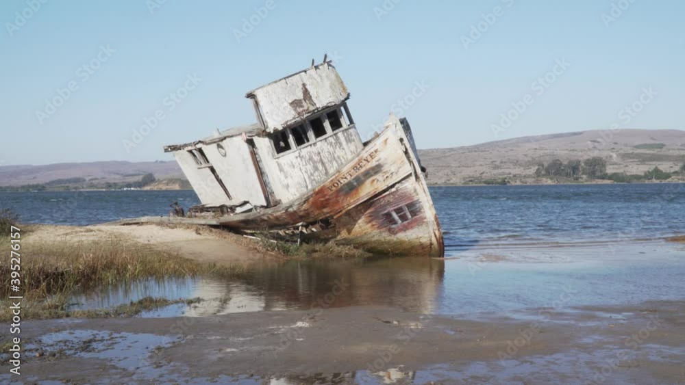 Tilt Shot of Beached Shipwreck Near the Sea in California. Tilt Shot of Beached Shipwreck Near the Sea in California.
