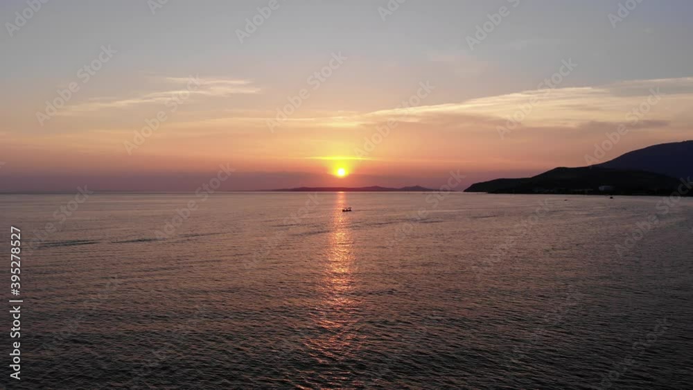 Aerial side flight over the sea while boat is passing sunlights on Marmara sea, Turkey. Aerial side flight over the sea while boat is passing sunlights on Marmara sea, Turkey.