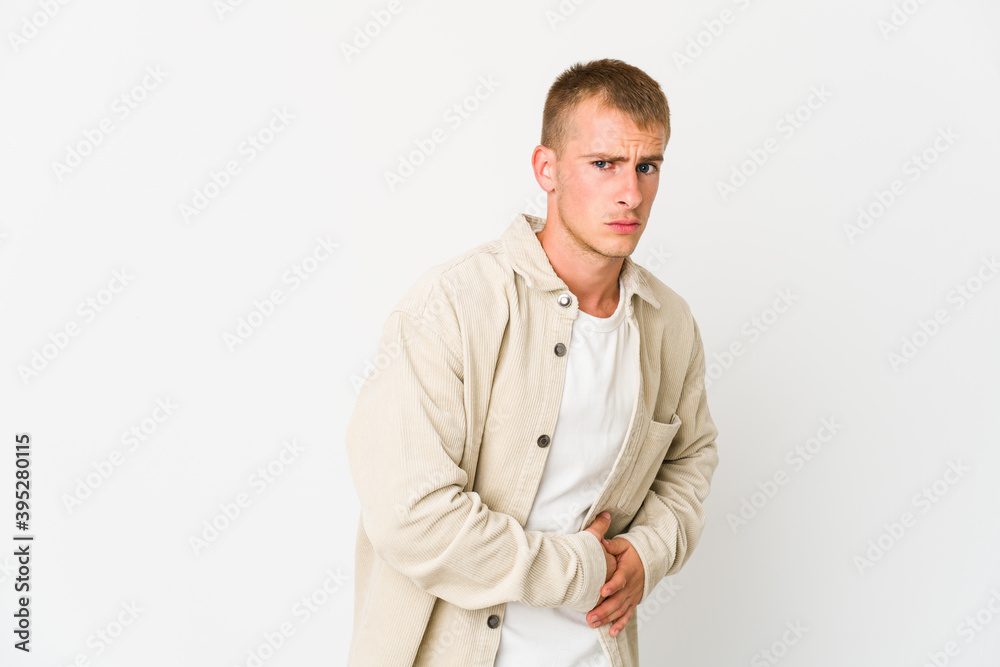Young caucasian handsome man having a liver pain, stomach ache. Young caucasian handsome man having a liver pain, stomach ache.