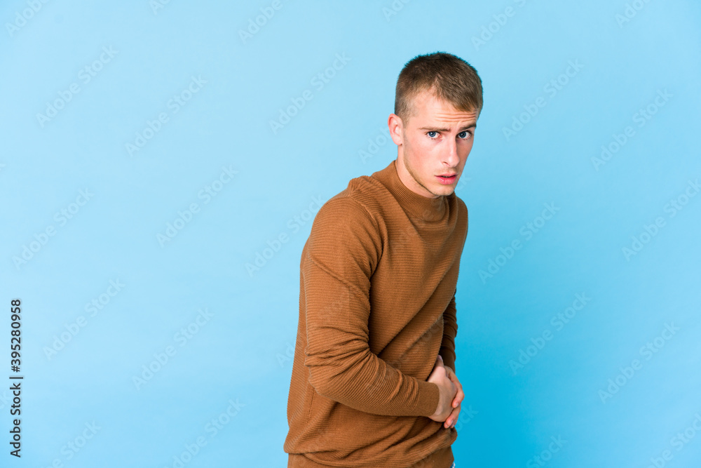 Young caucasian handsome man having a liver pain, stomach ache. Young caucasian handsome man having a liver pain, stomach ache.