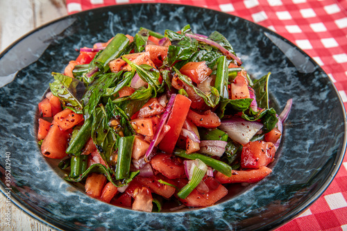 Tablaci Salad. They are indispensable flavors of Turkish cuisine. Especially with tomato and hot pepper sauce. Shepherd's salad, tomato salad and a great presentation. photo