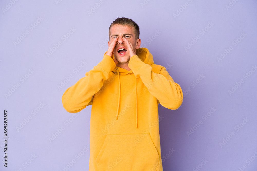 Young caucasian handsome man shouting excited to front. Young caucasian handsome man shouting excited to front.