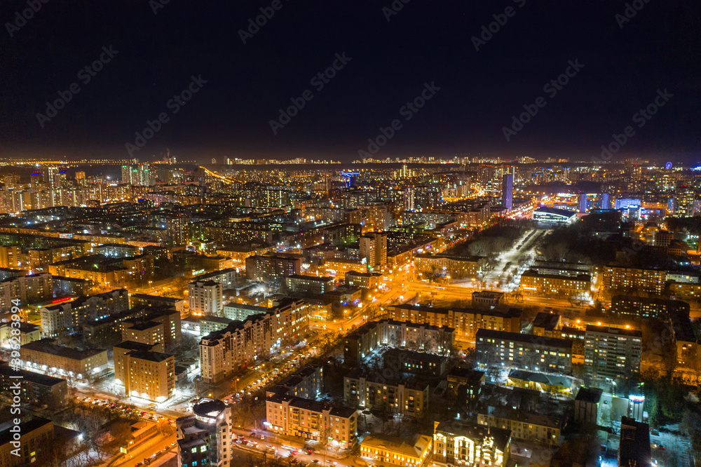 Aerial view of the night modern city. Bright lights of the night streets. Ekaterinburg. Russia