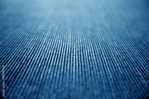 Textile pattern close-up with blur defocused effect in blue color.
