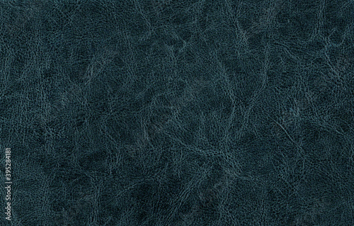 Leather surface close-up in cyan tone.