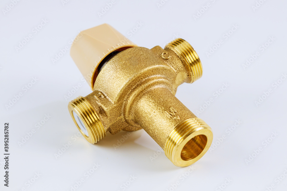Water various supply plumbing brass thermostatic mixing valve isolated on white background. Water various supply plumbing brass thermostatic mixing valve isolated on white background.