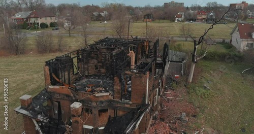 Drone view of dilapidated house in a Detroit neighborhood. This video was filmed in 4k for best image quality. photo