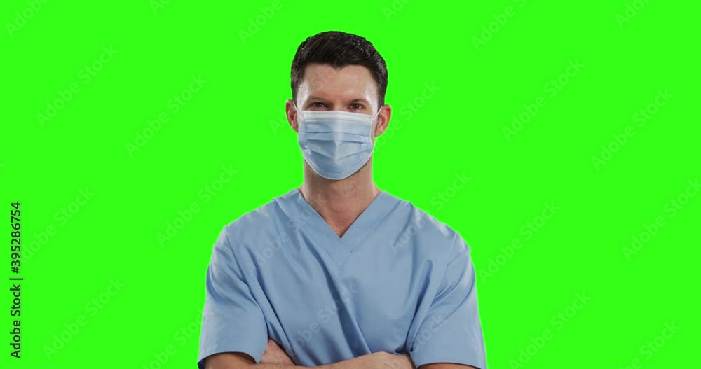 Caucasian male doctor wearing face mask on green screen background Caucasian male doctor wearing face mask on green screen background