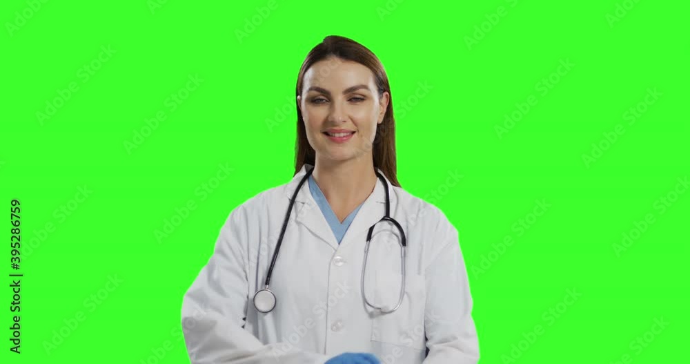 Caucasian female doctor on green screen background Caucasian female doctor on green screen background