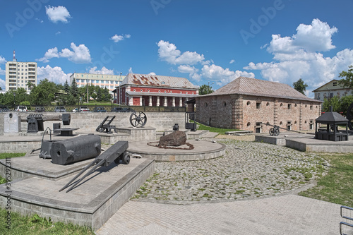Old warehouses and exhibition of mining equipment in Nizhny Tagil, Russia. Nizhny Tagil, founded in 1722, was one of the centers of Russian industrialization and major producer of cast iron and steel. photo