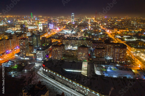 Aerial view of the night modern city. Bright lights of the night streets. Ekaterinburg. Russia
