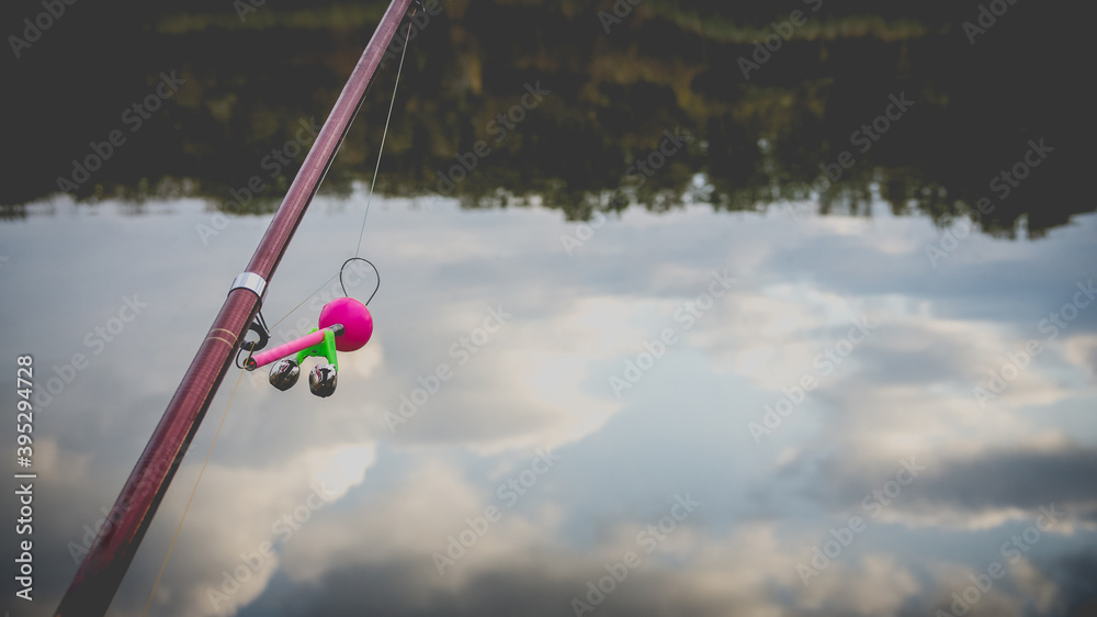 Autumn landscape with a fishing rod in the foreground. Autumn landscape with a fishing rod in the foreground.