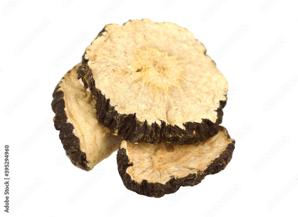 Closeup on Black Maca or Peruvian Ginseng Dry Root Slices (Lepidium Meyenii). Isolated on White. Closeup on Black Maca or Peruvian Ginseng Dry Root Slices (Lepidium Meyenii). Isolated on White.