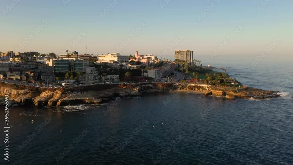 Snorkelers And Scuba Divers Exploring Ocean Water At La Jolla Cove In San Diego, California - aerial drone Snorkelers And Scuba Divers Exploring Ocean Water At La Jolla Cove In San Diego, California - aerial drone