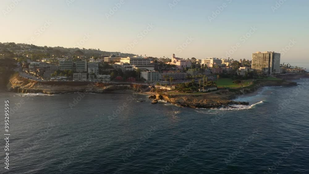 Picturesque Cove And Beach With Hotels On Rocky Cliffs At Early Morning In La Jolla, San Diego, California. - aerial Picturesque Cove And Beach With Hotels On Rocky Cliffs At Early Morning In La Jolla, San Diego, California. - aerial