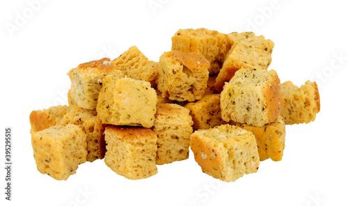 Group of baked crusty bread cube croutons isolated on a white background photo