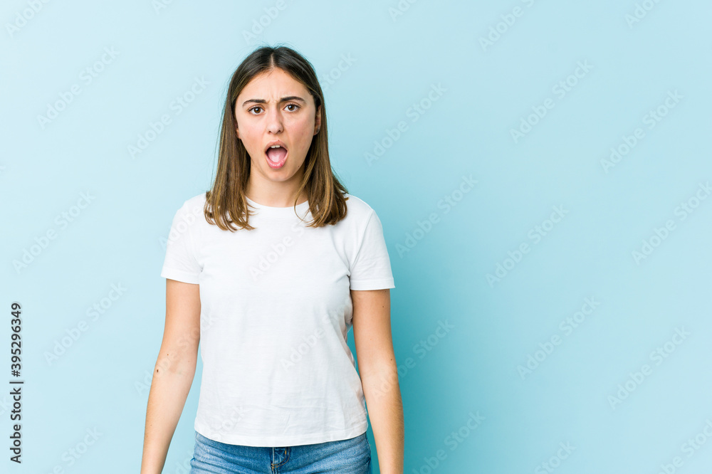 Young caucasian woman shouting very angry, rage concept, frustrated. Young caucasian woman shouting very angry, rage concept, frustrated.