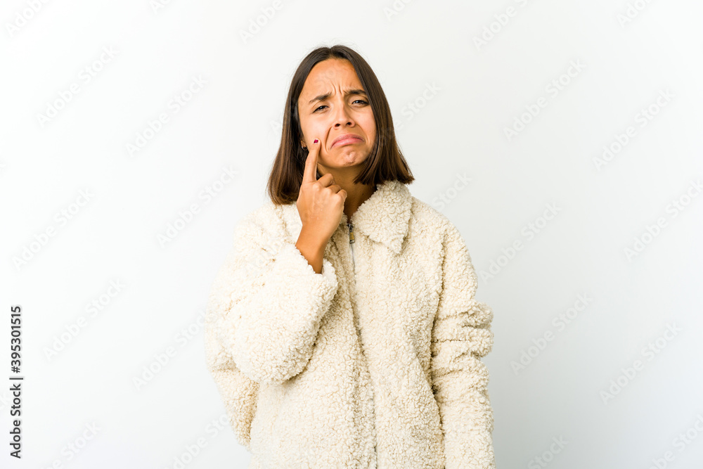 Young mixed race woman crying, unhappy with something, agony and confusion concept. Young mixed race woman crying, unhappy with something, agony and confusion concept.