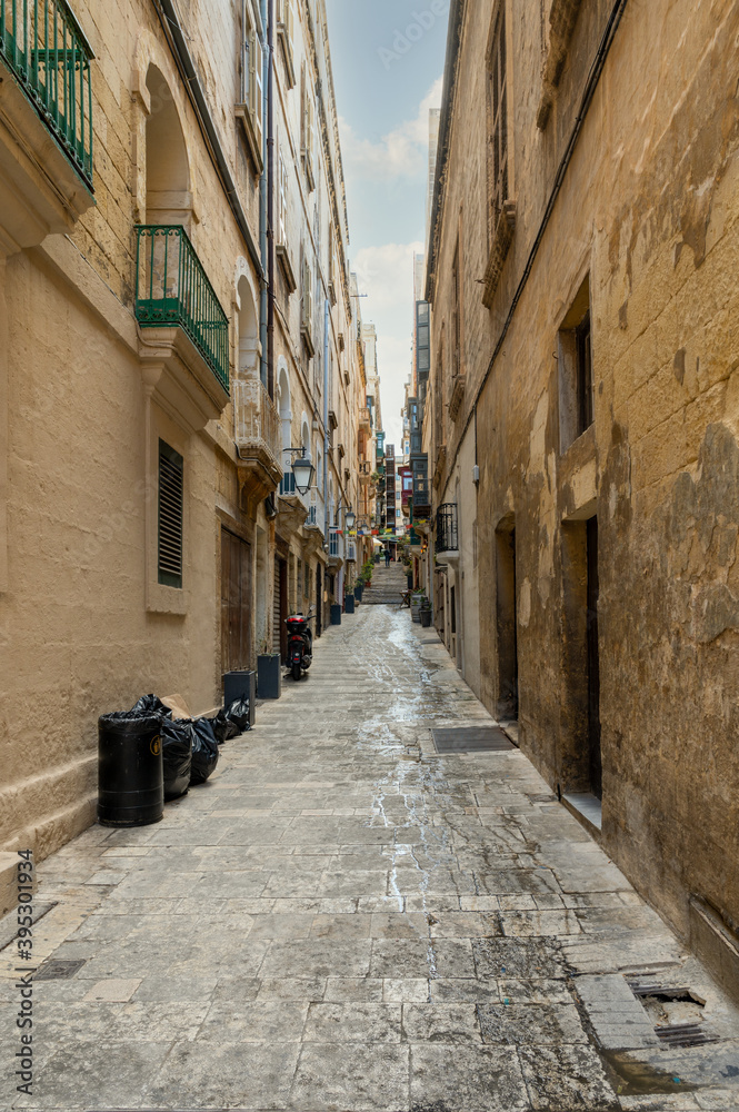 Narrow street leading to some steps in Valletta the capital city of Malta.