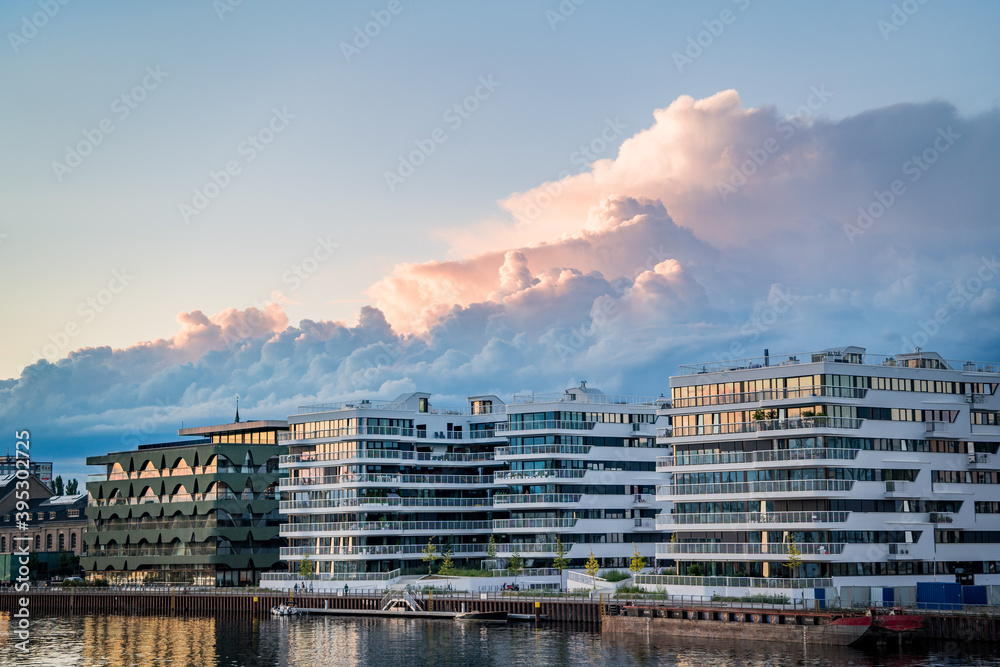 clouds over business buildings during sunset