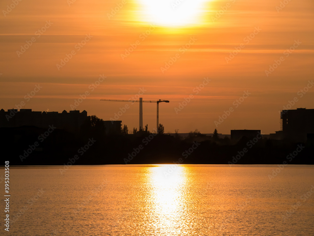 Beautiful sunset over Lake Dâmbovița (Lacul Morii) in Bucharest, Romania.