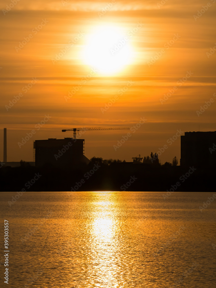 Beautiful sunset over Lake Dâmbovița (Lacul Morii) in Bucharest, Romania.