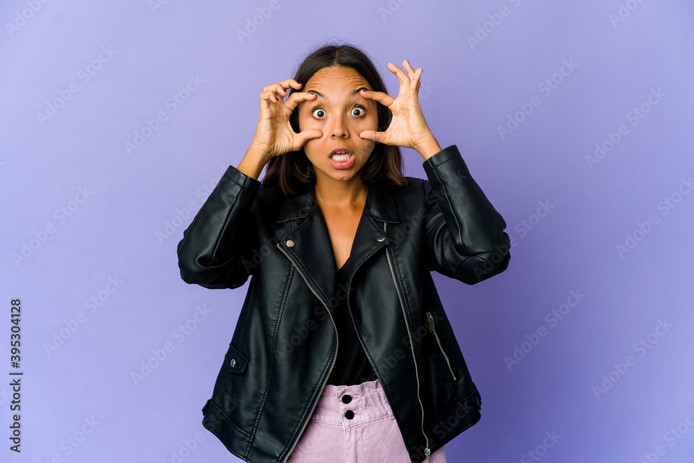 Young mixed race woman keeping eyes opened to find a success opportunity.