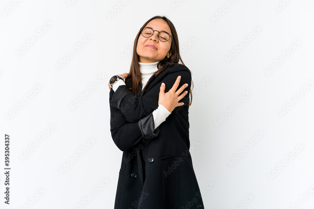 Young mixed race business woman isolated on white background hugs, smiling carefree and happy. Young mixed race business woman isolated on white background hugs, smiling carefree and happy.