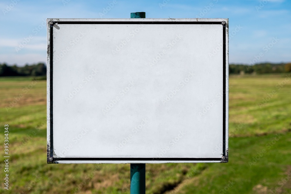 Old metal sign with lots of empty space